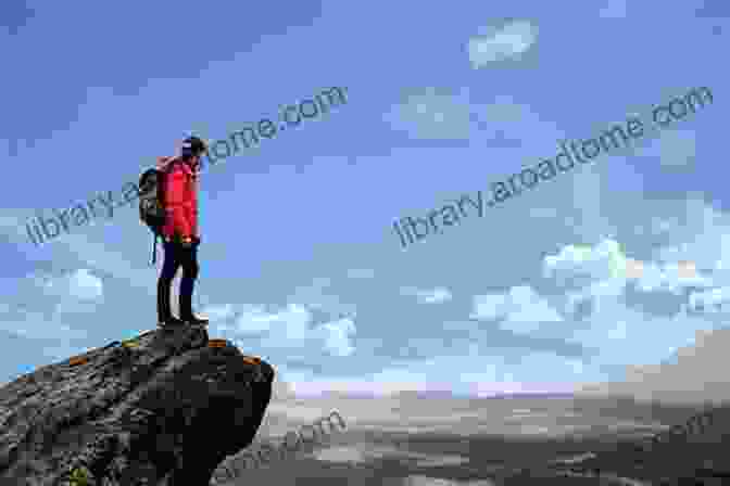A Breathtaking Image Of A Hiker Standing Atop A Mountain, Representing The Journey Towards Fulfillment Made In Reality