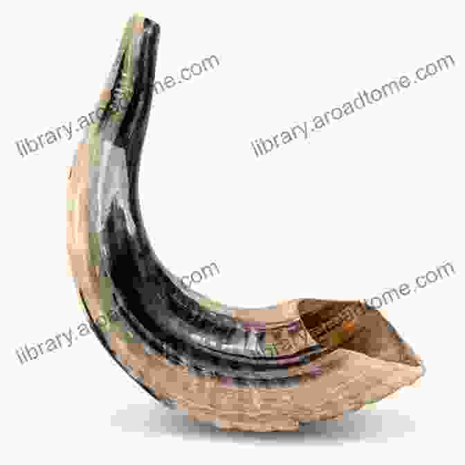 A Majestic Shofar, A Large Ram's Horn, With Intricate Engravings, Isolated On A Black Background, Symbolizing The Power And Spirituality Of The Instrument. Kol Shofar Voice Of The Shofar : A Manual For Spiritual Warfare Using The Shofar