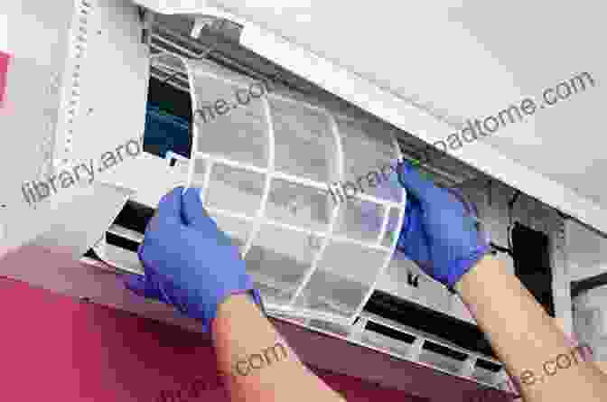 A Person Cleaning An Air Conditioner Filter AIR CONDITIONER MAINTENANCE: Step By Step Guide To Air Conditioner Maintenance