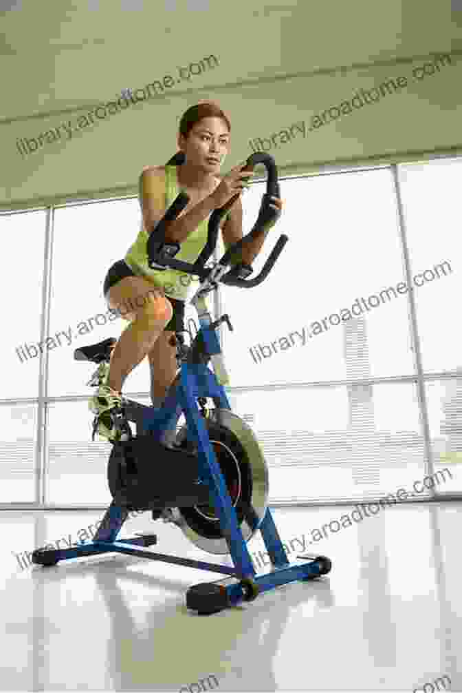 A Person Cycling On A Stationary Bike 10 Ways To Lose Fat In Under 10 Minutes: Secrets Of The Top Fitness Trainers