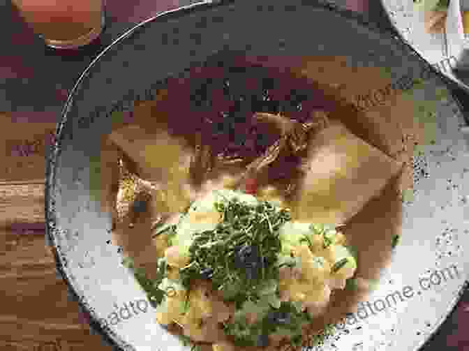 A Plate Of Maultaschen, Traditional Southwestern German Dumplings Filled With A Mixture Of Ground Meat, Spinach, And Herbs, Served In A Broth. German Food: Traditional Cuisine Dishes In Germany: Northern German Cuisine