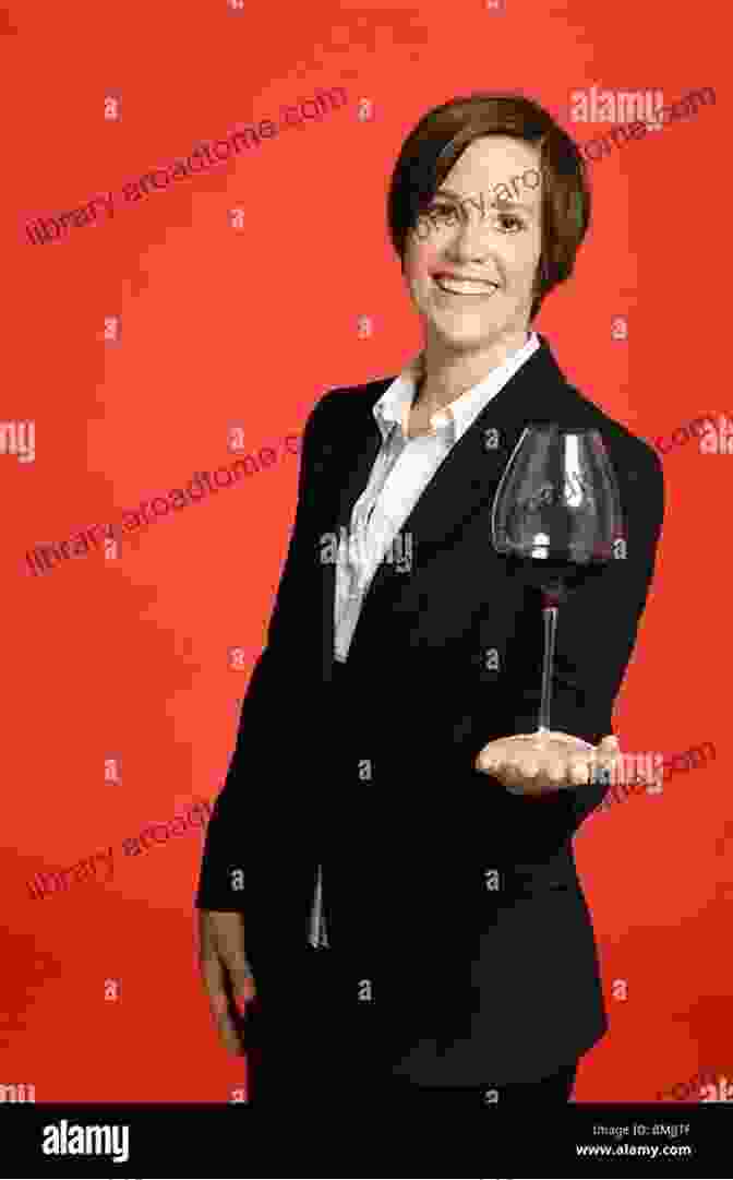 A Sommelier Holding A Glass Of Burgundy Champagne With The Vineyards In The Background, Showcasing The Beauty And Elegance Of This Renowned Wine Region. BURGUNDY CHAMPAGNE: A Sommelier Quickbook (Sommelier Quickbooks 1)