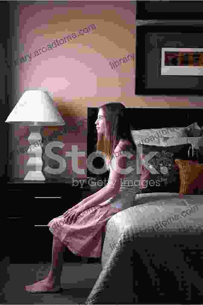 A Young Girl Sitting On The Edge Of A Bed, Looking Out The Window At A Sunset Out From Under