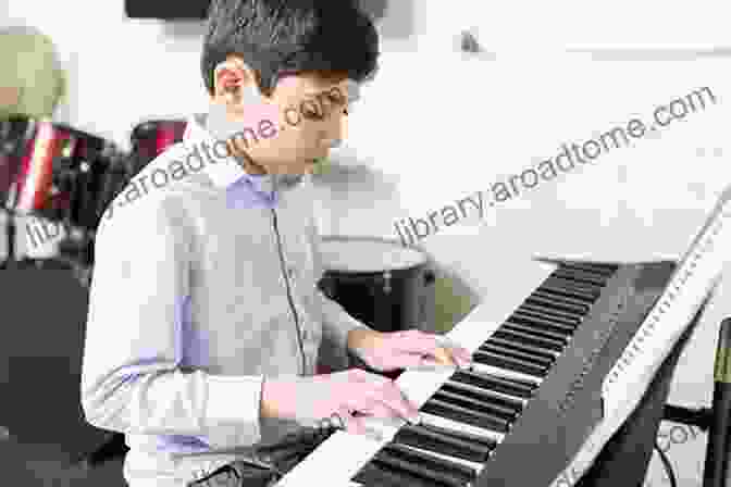 Male Student Practicing Piano In A Music Room. Pomp And Circumstance Elgar Beginner Piano Sheet Music