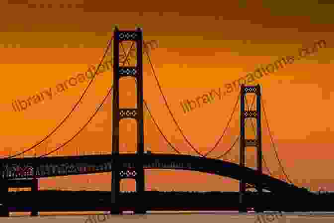 Sunset Over The Mackinac Bridge, Casting A Golden Glow On The Structure And Surrounding Waters Mackinac Bridge (Images Of America)